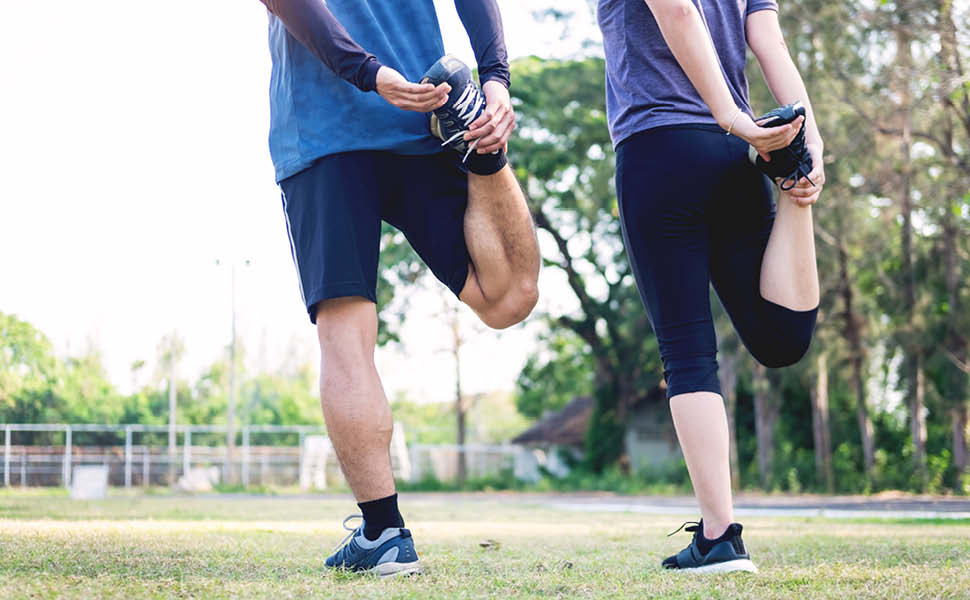 Pro-Tect Athletic socks, couple stretching their legs