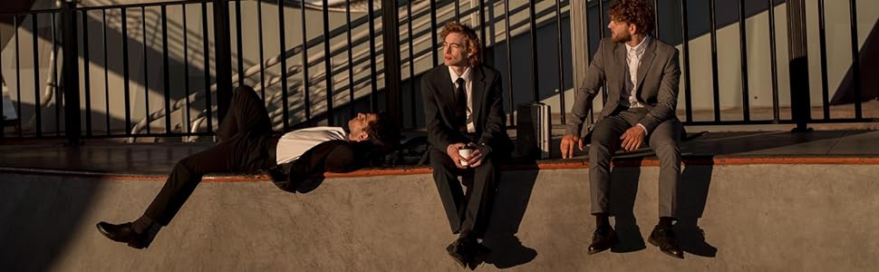 three young men in suits