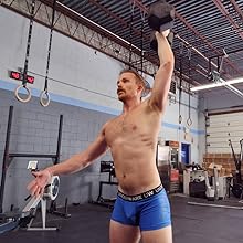 image of male working out at gym in UNDERWARE brand briefs; made for high performance training